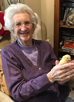 Warrendale Cottage Resident enjoying chick handing at Easter